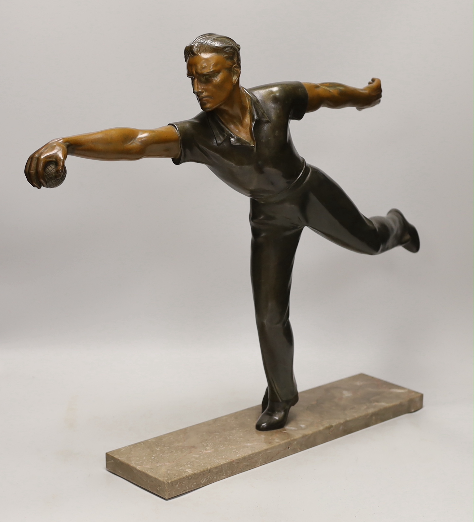 A French Art Deco spelter figure 'Petanque player' 60cm wide, 50cm high